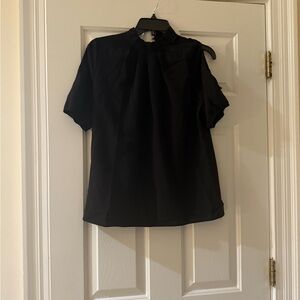 Elegant black Accent blouse with cutout sleeves.